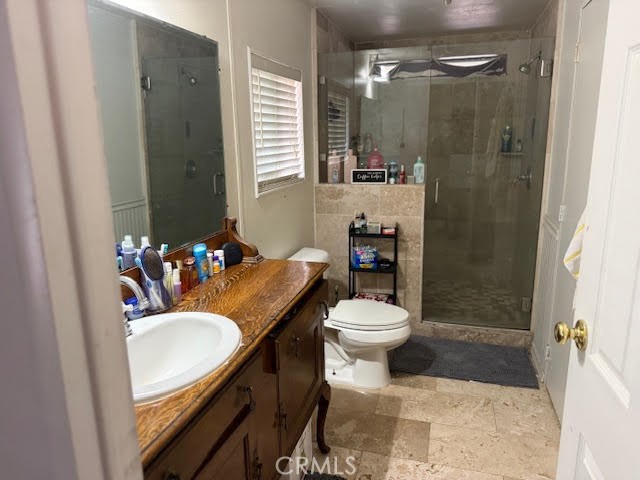 40995 Vía Fernando Temecula, CA 92592 - Photo 45 of 52 a bathroom with a sink toilet and shower