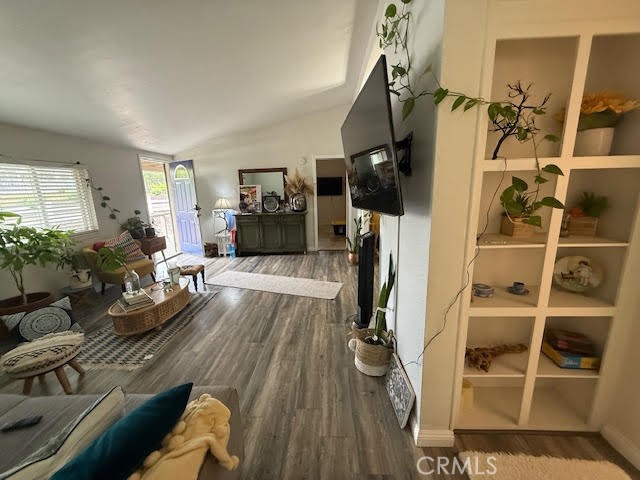 40995 Vía Fernando Temecula, CA 92592 - Photo 48 of 52 a living room with furniture a flat screen tv and a floor to ceiling window