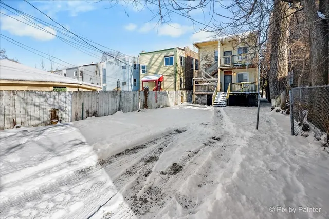 a view of a brick building with many windows