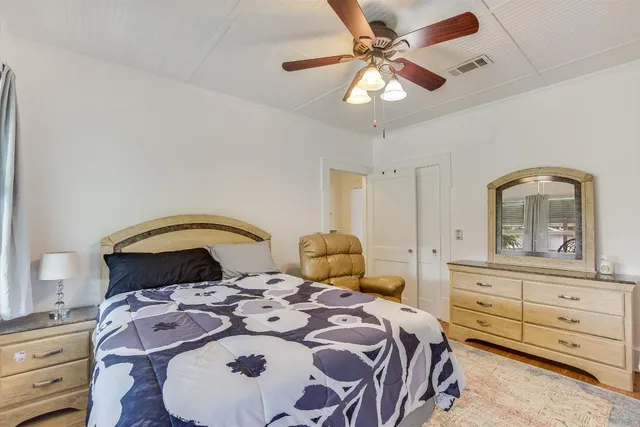 a bedroom with a bed and a dresser