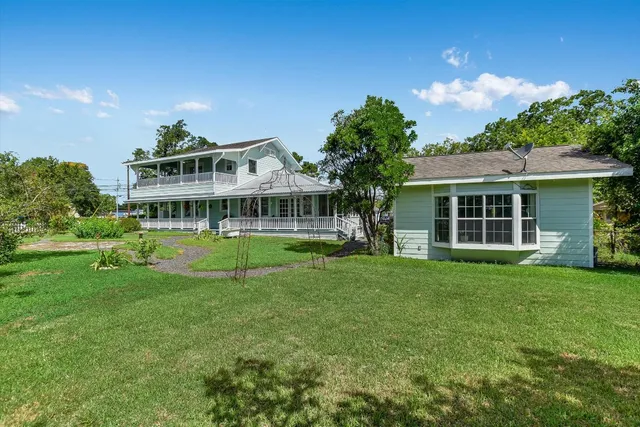 a view of a house with porch and sitting area