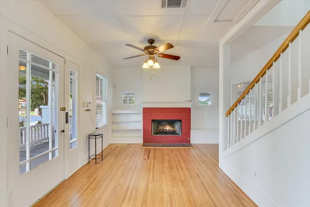 a view of an entryway with wooden floor