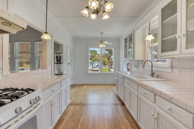 a large kitchen with a stove