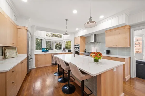 a dining room with furniture window and wooden floor
