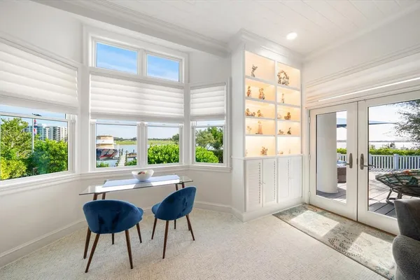 a view of a chair and table in the balcony