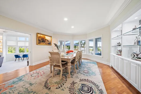 a view of a bedroom with wooden floor and stairs