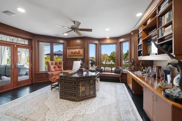 a bed room with a bed and a ceiling fan