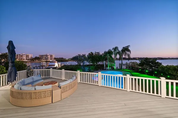 a bathroom with a toilet a sink a mirror a shower and vanity