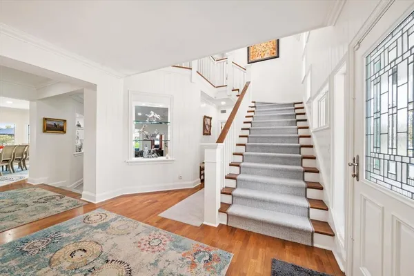 a bathroom with a granite countertop tub sink and mirror