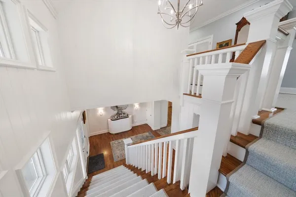 a view of balcony with two chairs and a potted plant