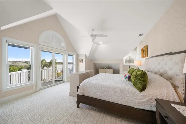 a view of a patio with a table chairs and a fire pit