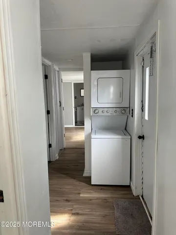 a view of a room with wooden floor