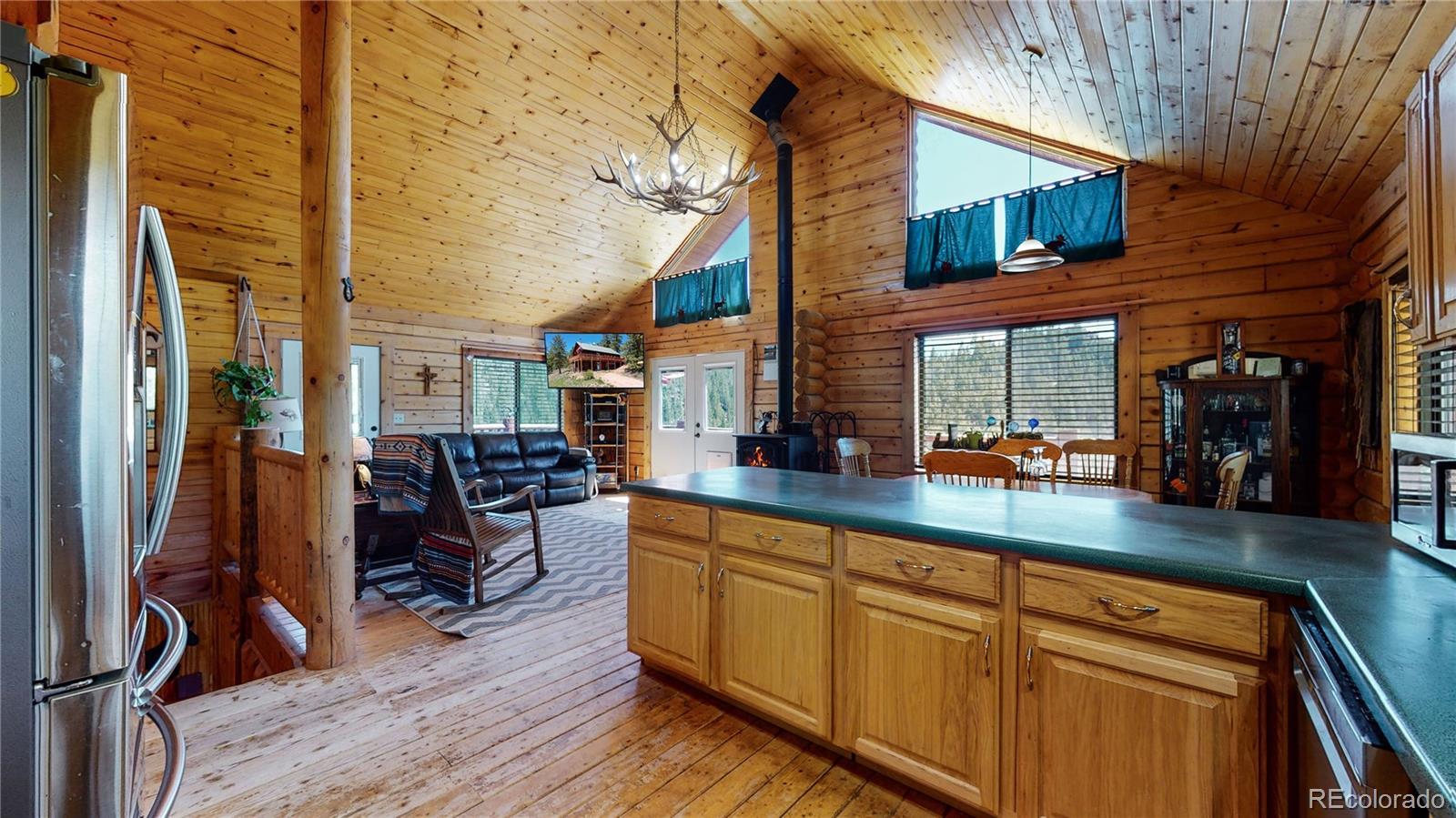 688 Beartrap Road Red Feather Lakes, CO 80545 - Photo 11 of 40 a view of living room with furniture and flat screen tv