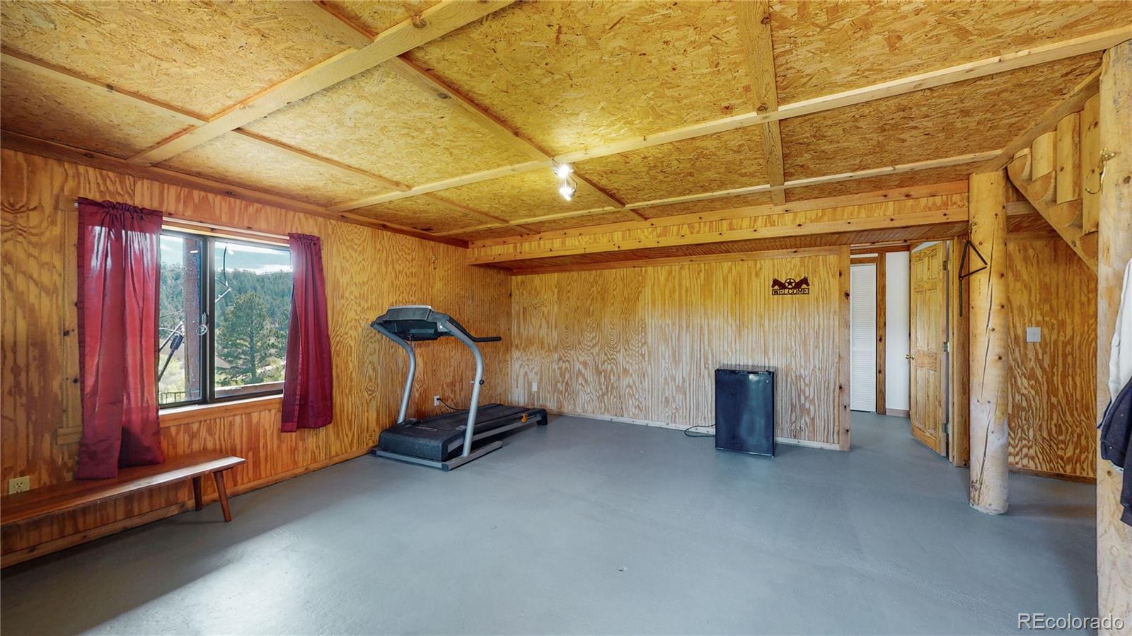688 Beartrap Road Red Feather Lakes, CO 80545 - Photo 22 of 40 a view of a room with gym equipment
