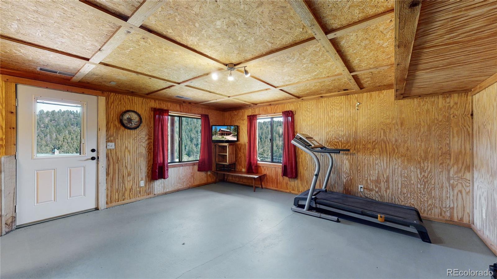 688 Beartrap Road Red Feather Lakes, CO 80545 - Photo 23 of 40 a view of a room with gym equipment
