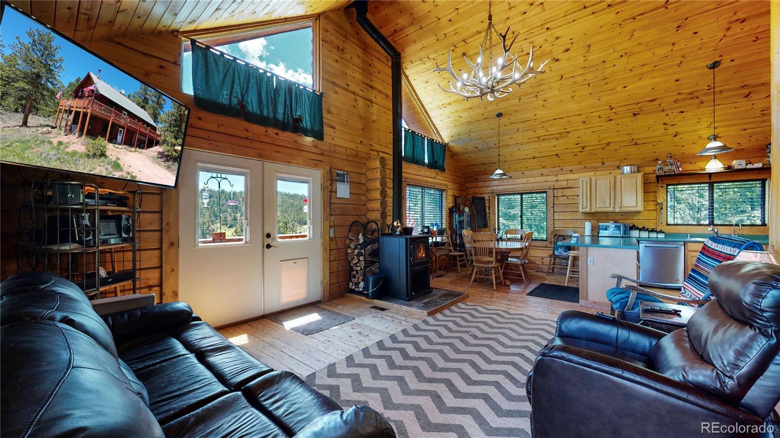 688 Beartrap Road Red Feather Lakes, CO 80545 - Photo 3 of 40 a view of a living room with furniture