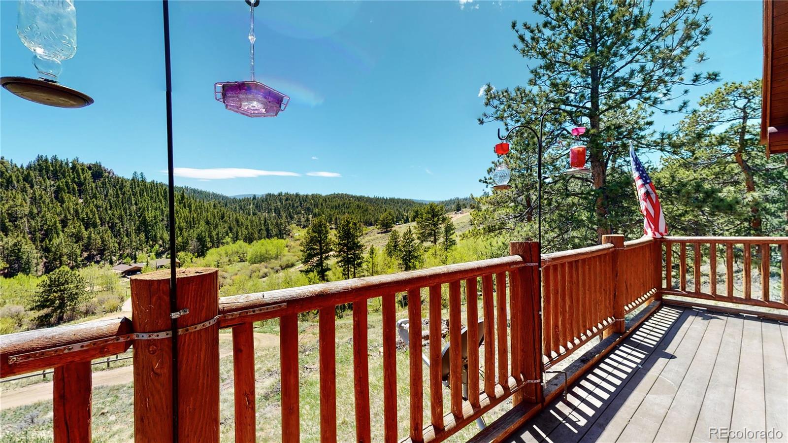 688 Beartrap Road Red Feather Lakes, CO 80545 - Photo 34 of 40 a view of a balcony with wooden floor