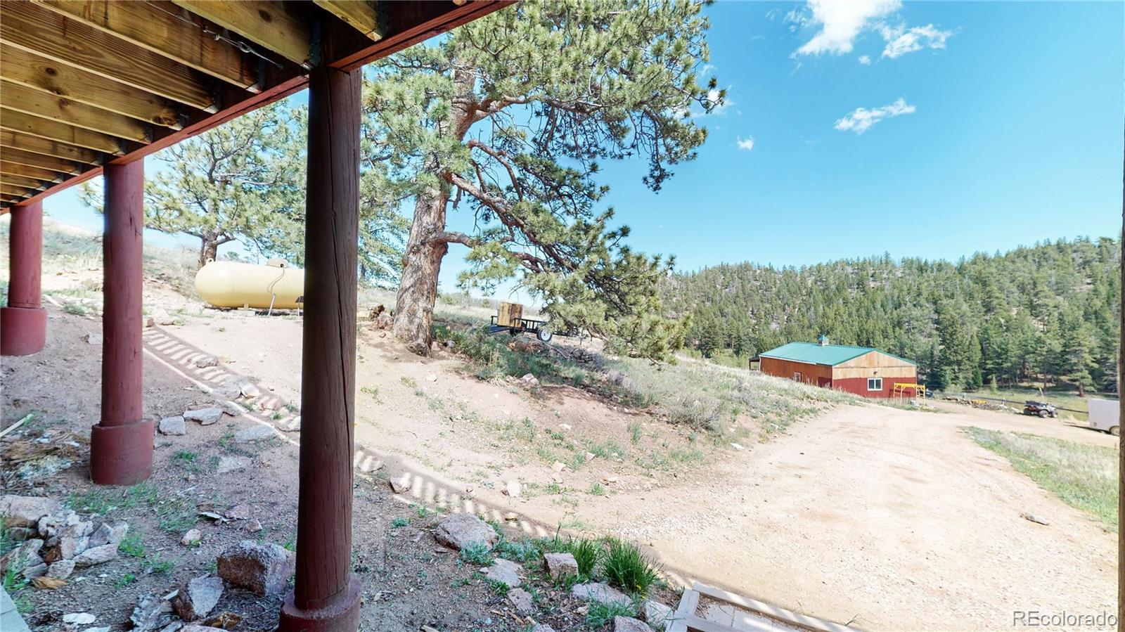 688 Beartrap Road Red Feather Lakes, CO 80545 - Photo 35 of 40 a view of a road from a balcony