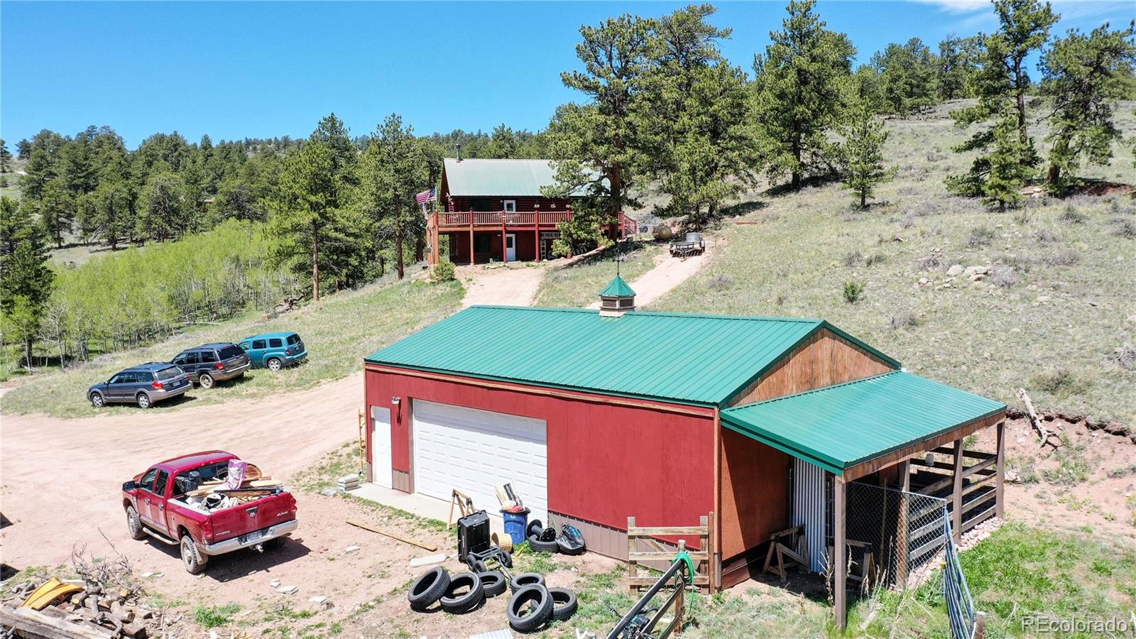 688 Beartrap Road Red Feather Lakes, CO 80545 - Photo 37 of 40 an aerial view of a house with a yard