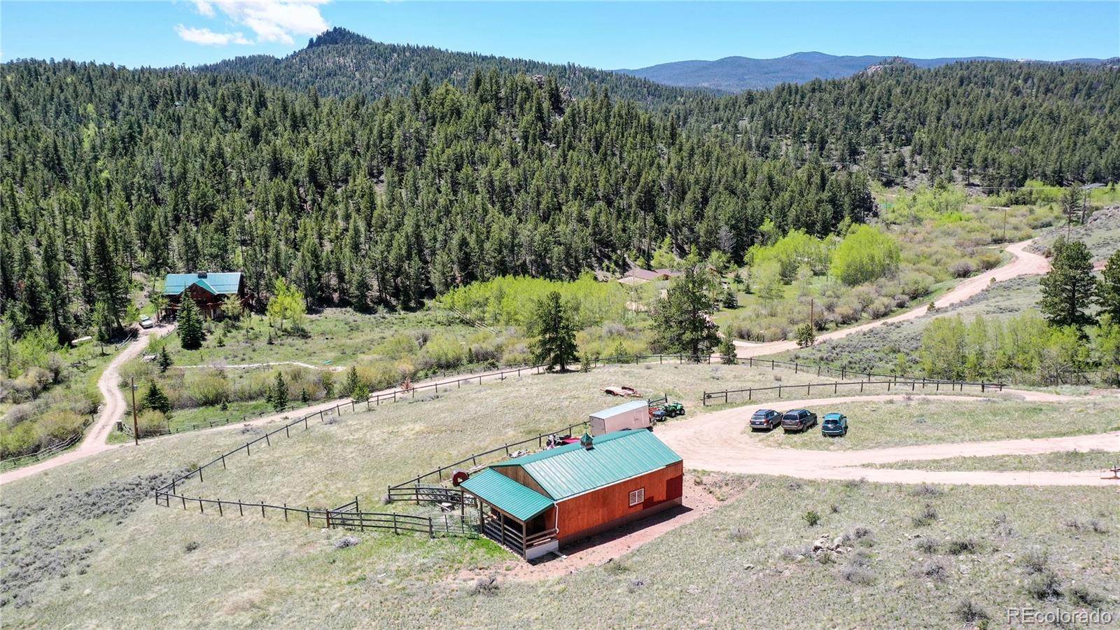 688 Beartrap Road Red Feather Lakes, CO 80545 - Photo 39 of 40 an aerial view of a house with a yard