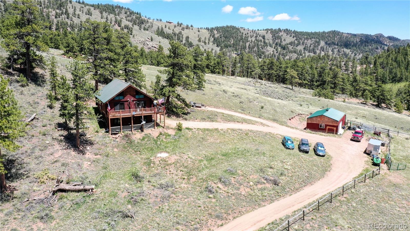688 Beartrap Road Red Feather Lakes, CO 80545 - Photo 40 of 40 a view of a house with a yard