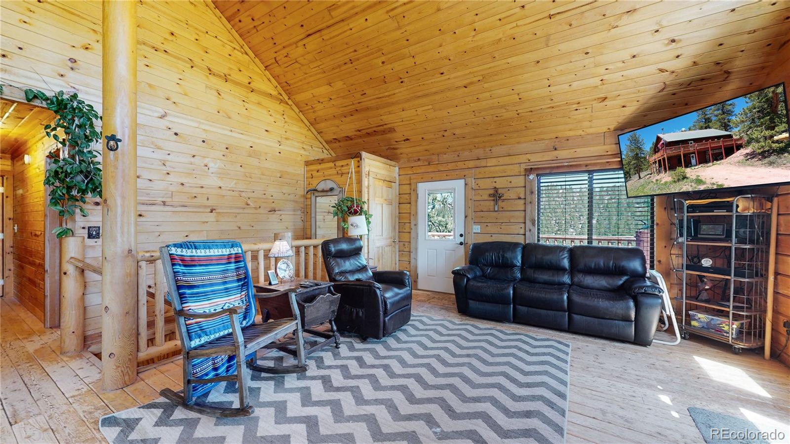 688 Beartrap Road Red Feather Lakes, CO 80545 - Photo 5 of 40 a living room with furniture and furniture