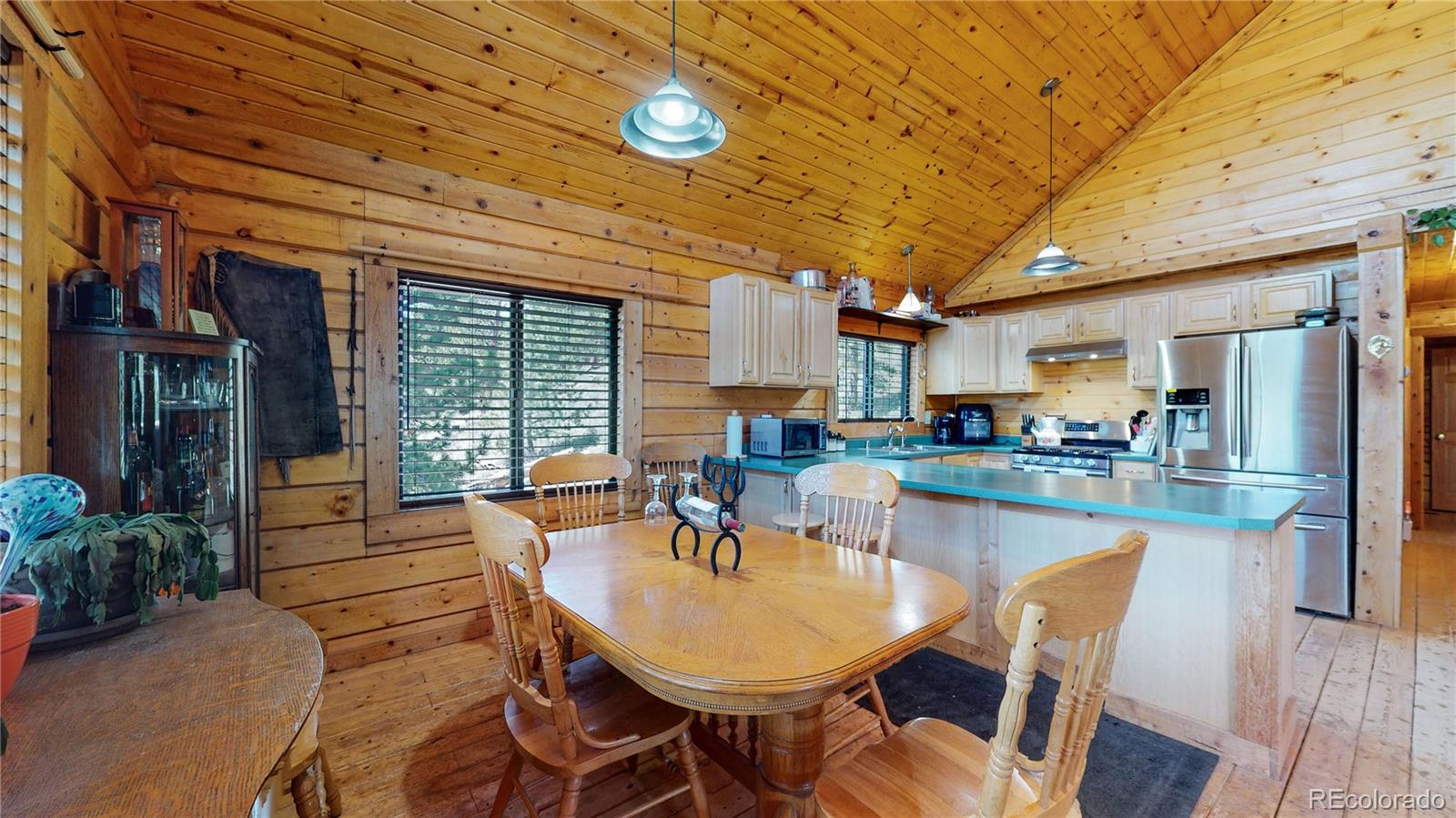 688 Beartrap Road Red Feather Lakes, CO 80545 - Photo 7 of 40 a outdoor space with lots of furniture and appliances