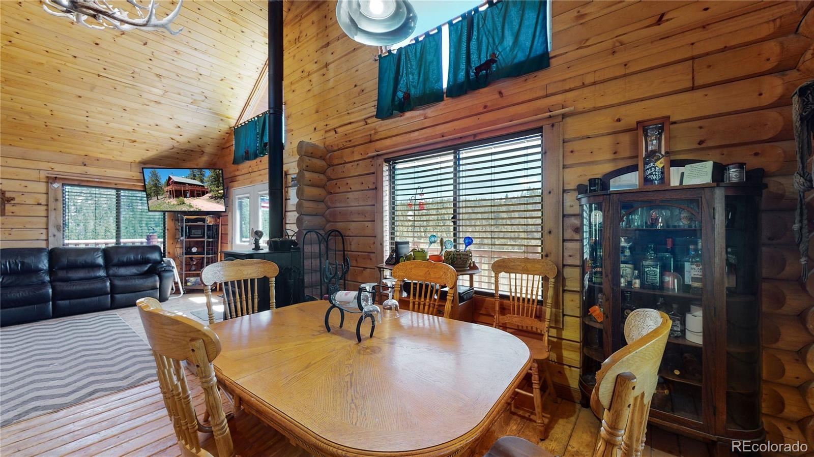 688 Beartrap Road Red Feather Lakes, CO 80545 - Photo 9 of 40 a dining room with outdoor seating