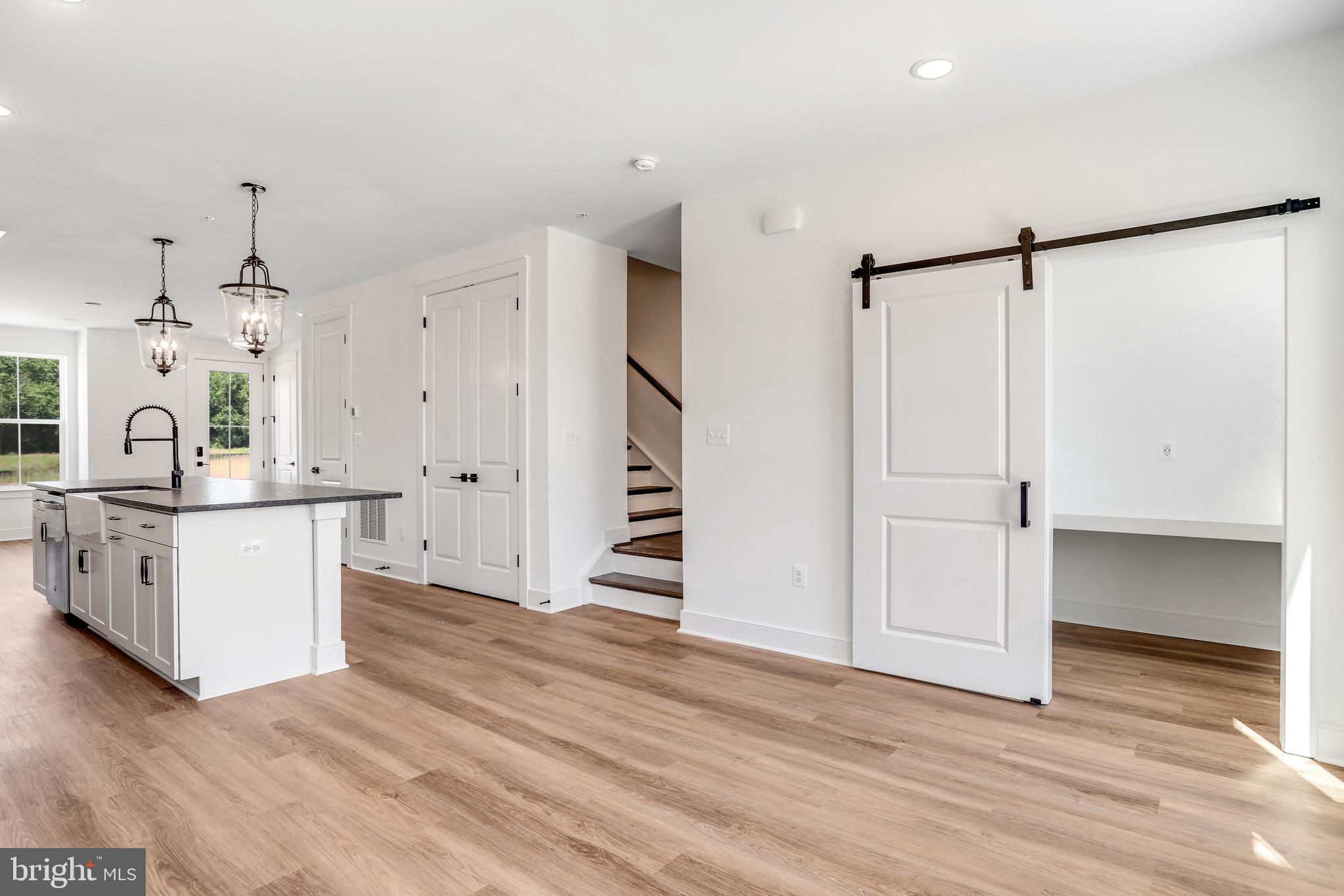 1803 Shookstown Road Frederick, MD 21702 - Photo 13 of 35 a view of kitchen with cabinets and wooden floor