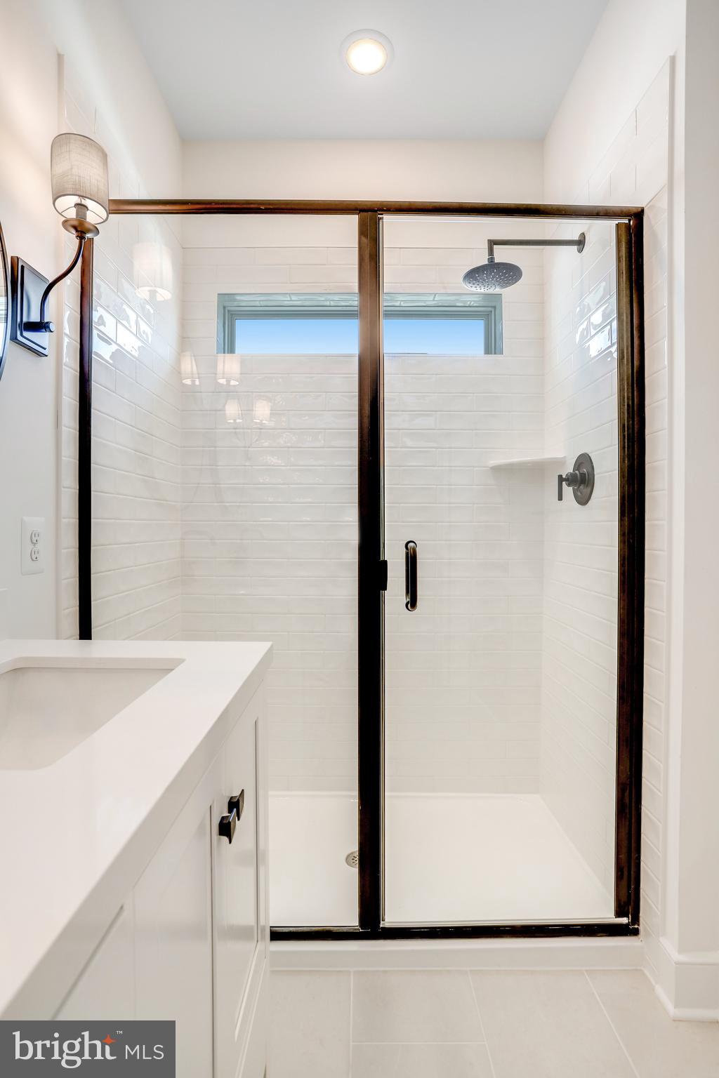 1803 Shookstown Road Frederick, MD 21702 - Photo 24 of 35 a bathroom with a shower and a sink