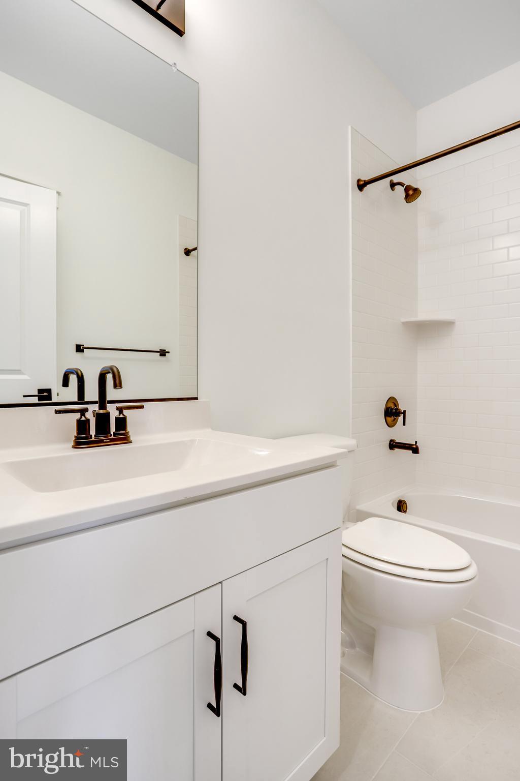 1803 Shookstown Road Frederick, MD 21702 - Photo 32 of 35 a bathroom with a sink a toilet and shower
