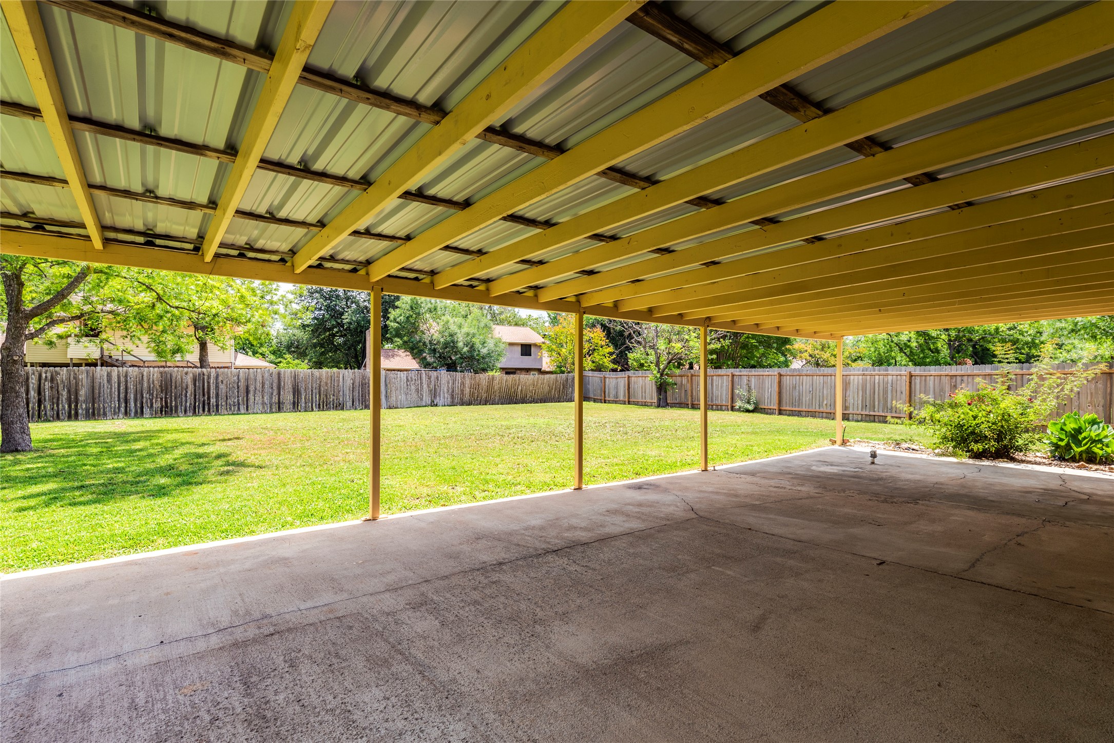 13505 Broadmeade Avenue Austin, TX 78729 - Photo 19 of 21 Fenced backyard with a patio area