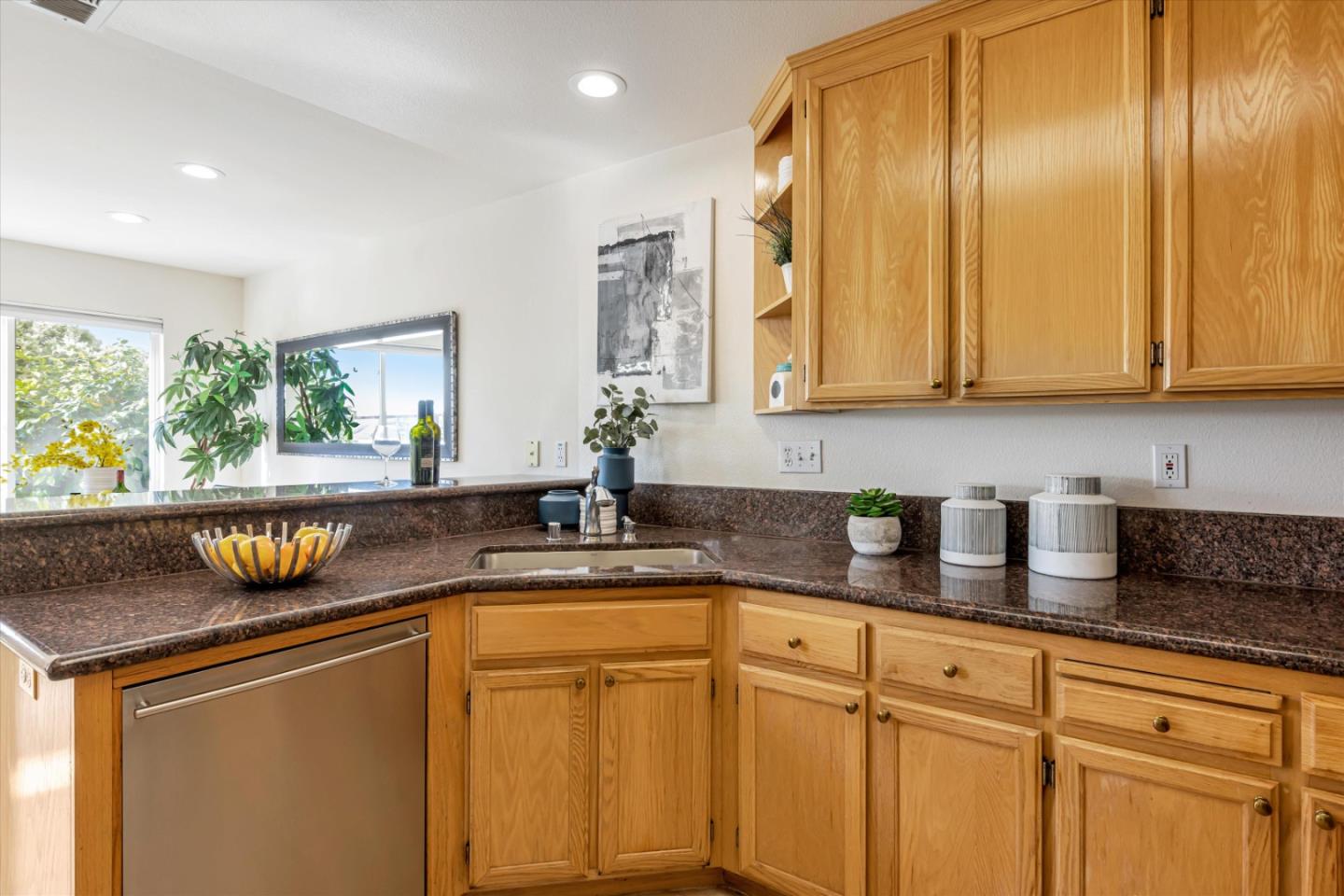 7863 Summerpointe Place Castro Valley, CA 94552 - Photo 13 of 43 a kitchen with stainless steel appliances granite countertop a sink a stove and cabinets