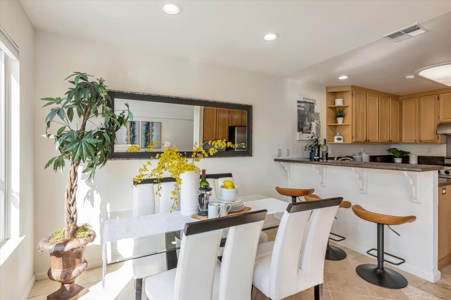 7863 Summerpointe Place Castro Valley, CA 94552 - Photo 19 of 43 a kitchen with stainless steel appliances granite countertop a refrigerator a stove a sink dishwasher and white cabinets with wooden floor