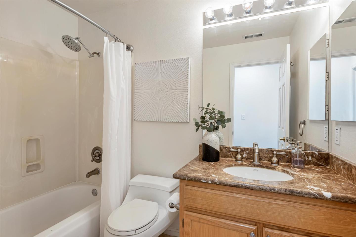 7863 Summerpointe Place Castro Valley, CA 94552 - Photo 31 of 43 a bathroom with a granite countertop sink toilet and shower