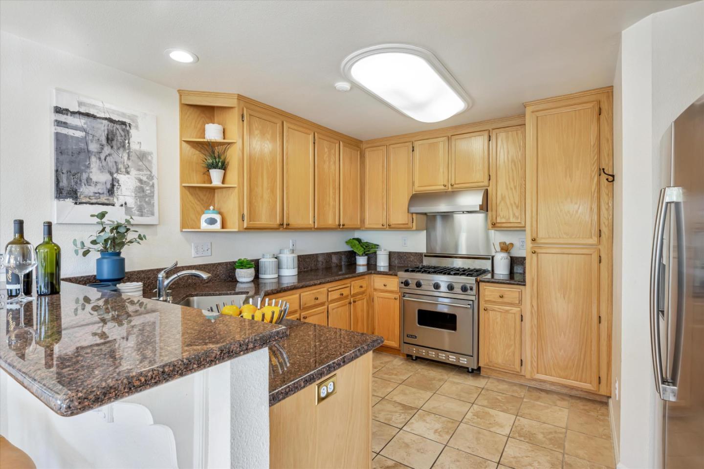 7863 Summerpointe Place Castro Valley, CA 94552 - Photo 10 of 43 a kitchen with stainless steel appliances granite countertop a sink stove and refrigerator