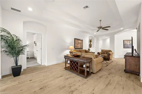 a bed room with furniture and a potted plant