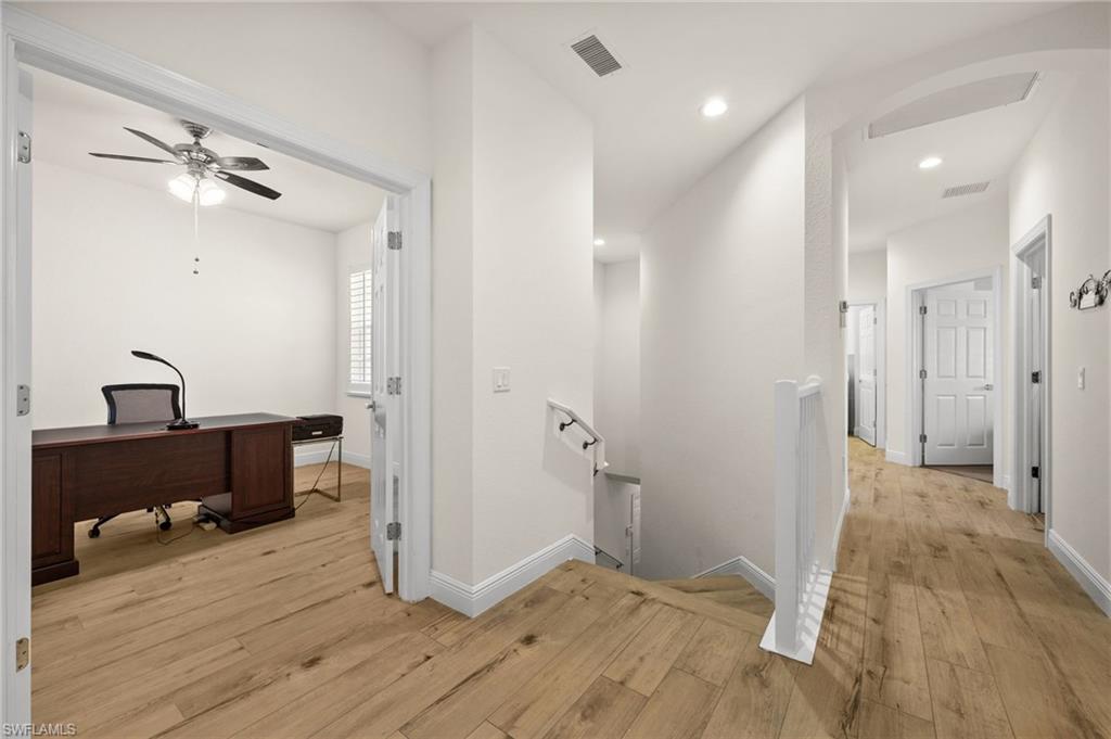 14562 Bellino Terrace, Unit 201 Bonita Springs, FL 34135 - Photo 15 of 46 a view of a room with wooden floor and closet