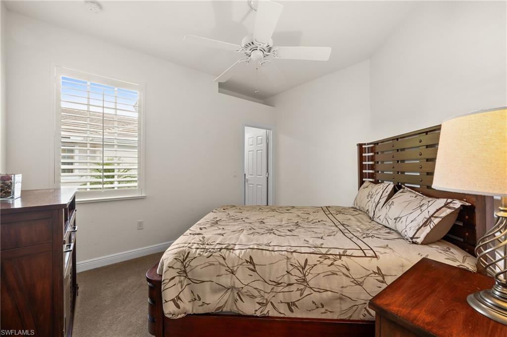 14562 Bellino Terrace, Unit 201 Bonita Springs, FL 34135 - Photo 21 of 46 a bedroom with a bed and a window