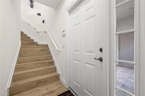 a view of a hallway with stairs
