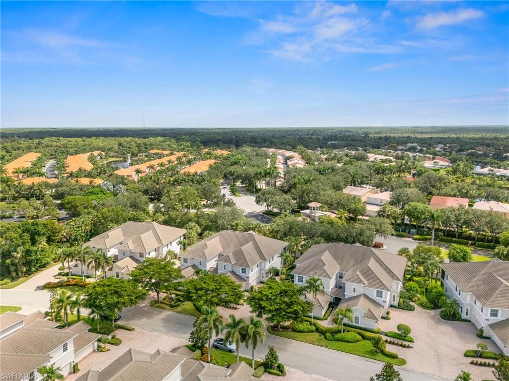 14562 Bellino Terrace, Unit 201 Bonita Springs, FL 34135 - Photo 35 of 46 an aerial view of residential house with outdoor space and trees all around
