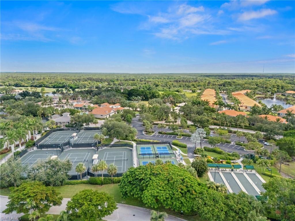 14562 Bellino Terrace, Unit 201 Bonita Springs, FL 34135 - Photo 42 of 46 an aerial view of residential houses with outdoor space and trees