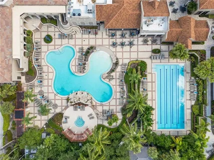 an aerial view of a swimming pool and outdoor space