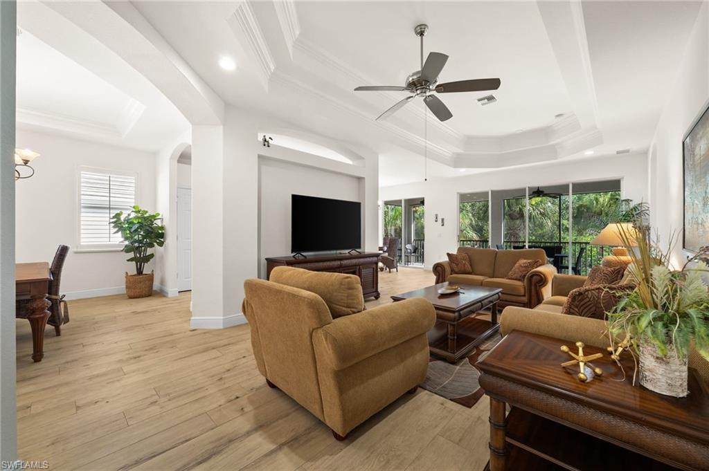 14562 Bellino Terrace, Unit 201 Bonita Springs, FL 34135 - Photo 10 of 46 a living room with furniture and a large window