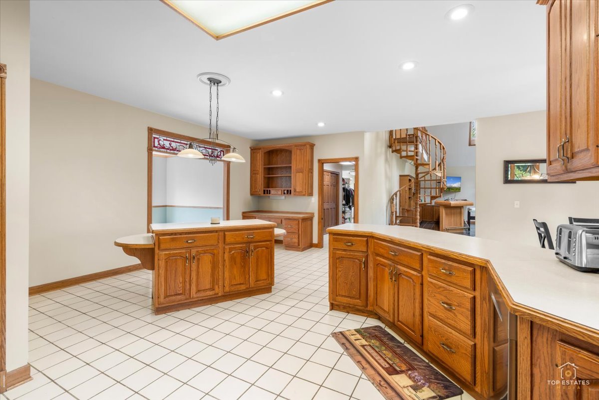 601 Ridgelawn Trail Batavia, IL 60510 - Photo 16 of 57 a kitchen with stainless steel appliances granite countertop a sink and cabinets