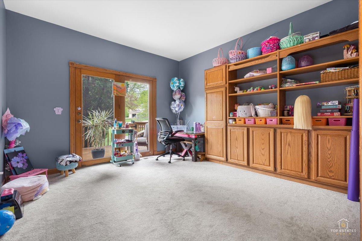 601 Ridgelawn Trail Batavia, IL 60510 - Photo 18 of 57 a view of a room with lots of stuff and toys