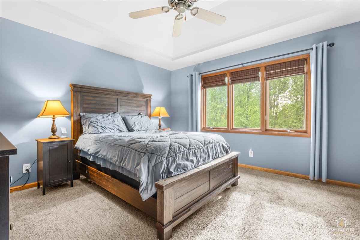 601 Ridgelawn Trail Batavia, IL 60510 - Photo 29 of 57 a bed sitting in a bedroom next to a window