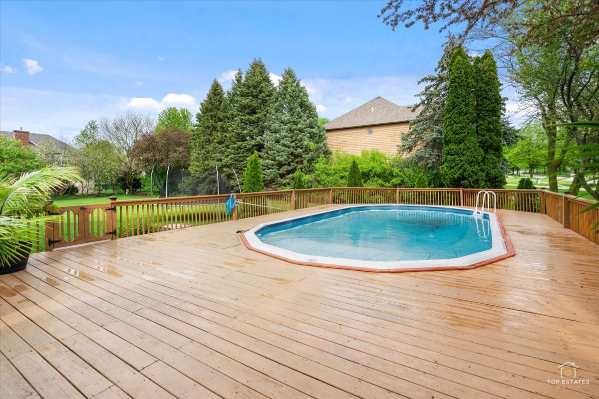 601 Ridgelawn Trail Batavia, IL 60510 - Photo 35 of 57 a view of a swimming pool with a yard