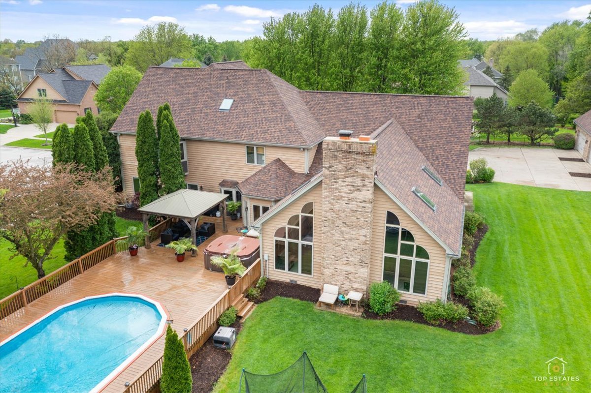 601 Ridgelawn Trail Batavia, IL 60510 - Photo 41 of 57 an aerial view of a house with swimming pool garden and patio