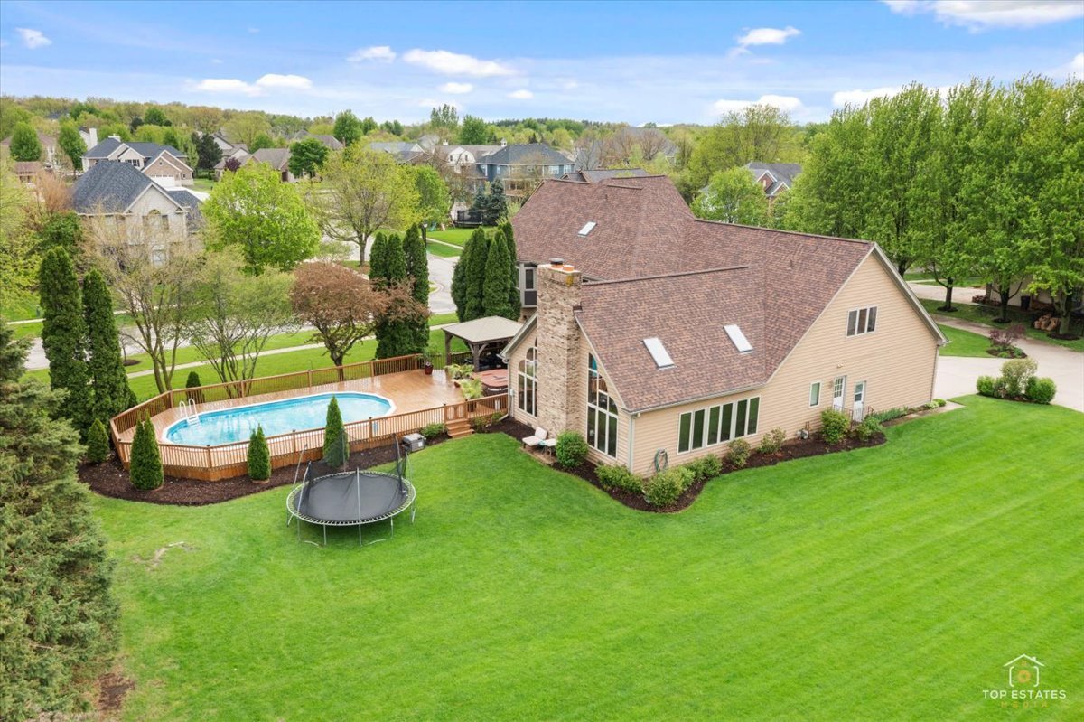 601 Ridgelawn Trail Batavia, IL 60510 - Photo 43 of 57 an aerial view of a house with backyard garden and swimming pool